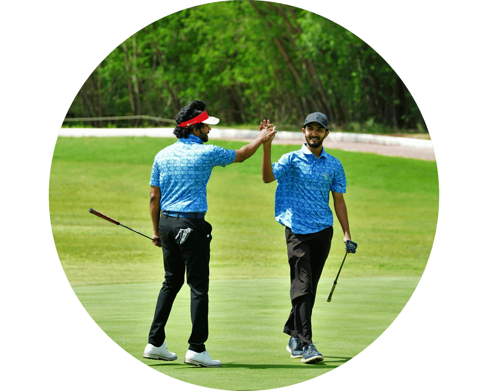 Two friends high-fiving while playing golf
