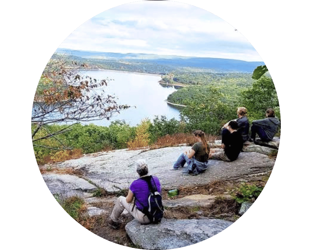 West Milford Circle Hikers sitting at cliff in West Milford