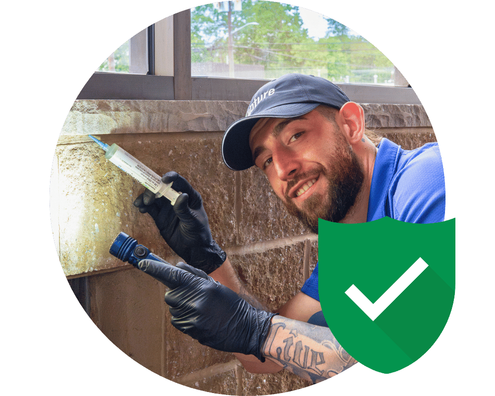 West Orange Guarantee pest control technician on service call in West Orange